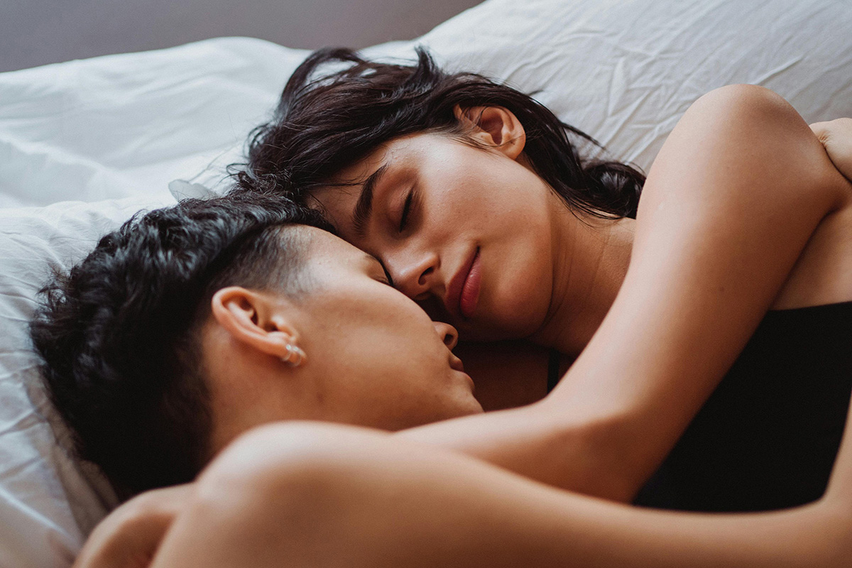 Couple sleeping in each other's arms