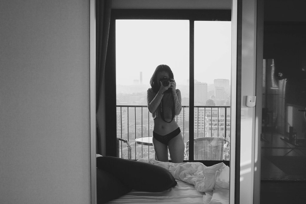 Black sexy lingerie woman and camera-dress dark